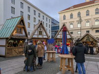 Visitors experience the festive atmosphere of the Medieval Christmas Market in Munich, Bavaria, Germany, on December 6, 2024. The market, lo...