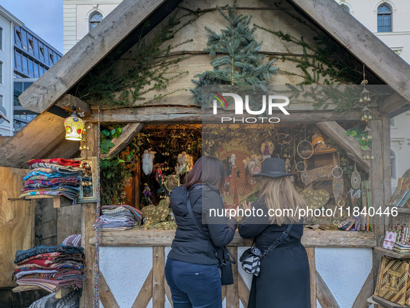 Visitors experience the festive atmosphere of the Medieval Christmas Market in Munich, Bavaria, Germany, on December 6, 2024. The market, lo...