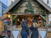 Visitors experience the festive atmosphere of the Medieval Christmas Market in Munich, Bavaria, Germany, on December 6, 2024. The market, lo...