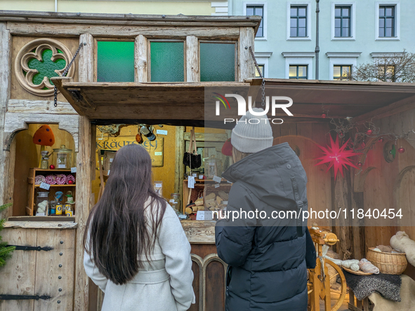 Visitors experience the festive atmosphere of the Medieval Christmas Market in Munich, Bavaria, Germany, on December 6, 2024. The market, lo...