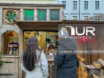 Visitors experience the festive atmosphere of the Medieval Christmas Market in Munich, Bavaria, Germany, on December 6, 2024. The market, lo...