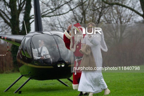 Santa Claus with an angel arrives in Essen Steele, Germany, on December 6, 2024. 