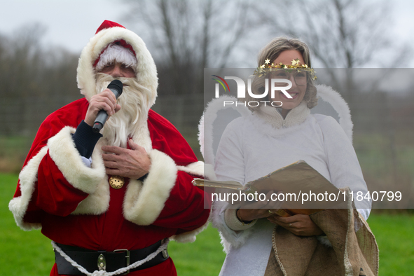 Santa Claus with an angel arrives in Essen Steele, Germany, on December 6, 2024. 