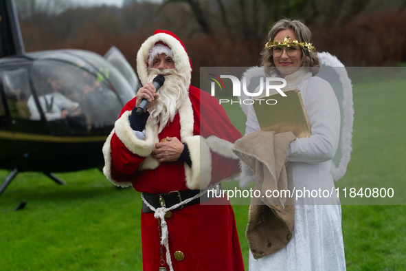 Santa Claus with an angel arrives in Essen Steele, Germany, on December 6, 2024. 