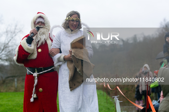 Santa Claus with an angel arrives in Essen Steele, Germany, on December 6, 2024. 