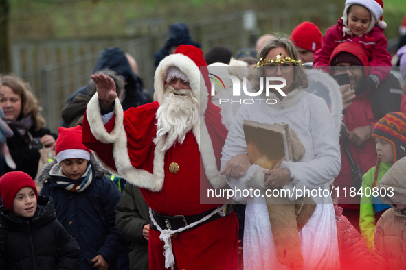 Santa Claus with an angel arrives in Essen Steele, Germany, on December 6, 2024. 