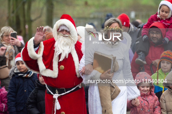 Santa Claus with an angel arrives in Essen Steele, Germany, on December 6, 2024. 