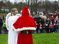 Santa Claus with an angel arrives in Essen Steele, Germany, on December 6, 2024. (