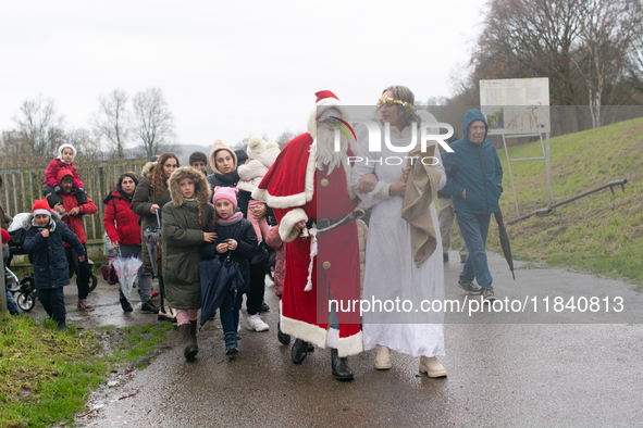 Santa Claus with an angel arrives in Essen Steele, Germany, on December 6, 2024. 