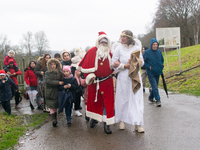 Santa Claus with an angel arrives in Essen Steele, Germany, on December 6, 2024. (