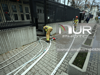 Police, city guards and fire services exercise emergency drills at the US embassy in Warsaw, Poland on 06 December, 2024. Emergency services...