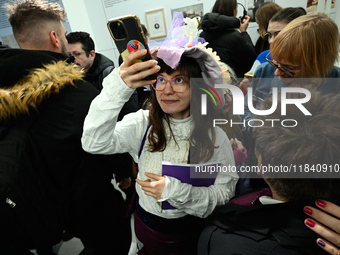 Visitors attend the opening of the country’s first queer museum in Warsaw, Poland on 06 December, 2024. The QueeMuzeum is a cultural space t...