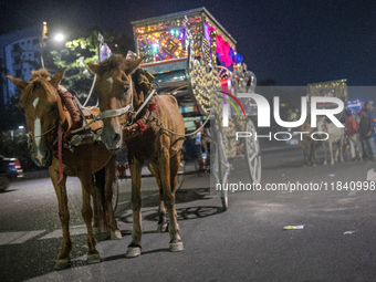 Horse carts wait by the roadside for city dwellers to take leisurely rides during a public holiday in Dhaka, Bangladesh, on December 6, 2024...