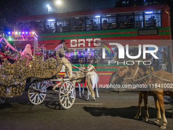 City dwellers ride on a horse cart during a public holiday in Dhaka, Bangladesh, on December 6, 2024. Horse cart rides, a nostalgic mode of...