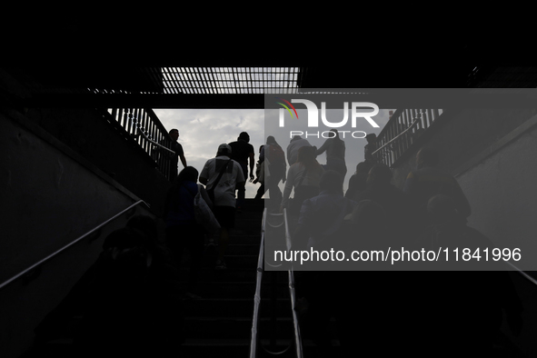 Backlight of people leaving the Zocalo subway in Mexico City, Mexico, on December 6, 2024. 