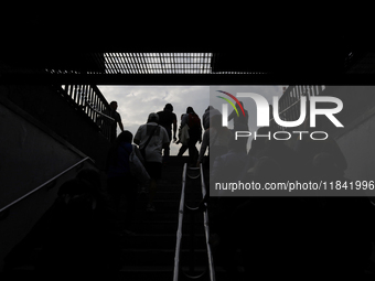 Backlight of people leaving the Zocalo subway in Mexico City, Mexico, on December 6, 2024. (