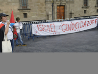 Palestinian activists and supporters demonstrate against the genocide in Gaza in the Zocalo of Mexico City, Mexico, on December 6, 2024, to...