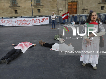 Palestinian activists and supporters demonstrate against the genocide in Gaza in the Zocalo of Mexico City, Mexico, on December 6, 2024, to...