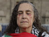 A woman sympathetic to Palestine demonstrates against the genocide in Gaza in the Zocalo of Mexico City, Mexico, on December 6, 2024, to dem...