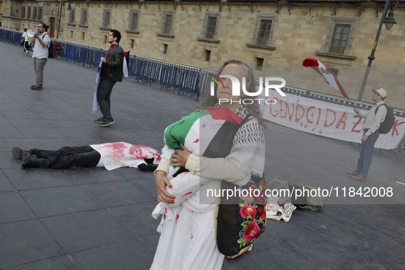 A woman sympathetic to Palestine demonstrates against the genocide in Gaza in the Zocalo of Mexico City, Mexico, on December 6, 2024, to dem...