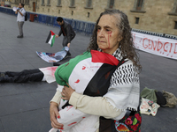 A woman sympathetic to Palestine demonstrates against the genocide in Gaza in the Zocalo of Mexico City, Mexico, on December 6, 2024, to dem...