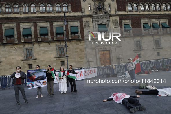 Palestinian activists and supporters demonstrate against the genocide in Gaza in the Zocalo of Mexico City, Mexico, on December 6, 2024, to...