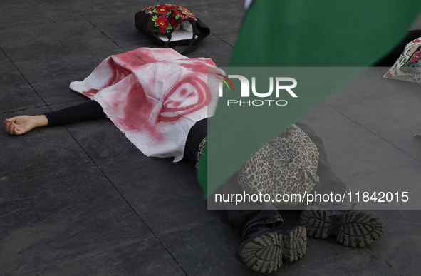 Palestinian activists and supporters demonstrate against the genocide in Gaza in the Zocalo of Mexico City, Mexico, on December 6, 2024, to...