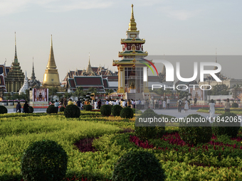 Buddhists and devotees pay homage to the Buddha's sacred tooth relics, which are temporarily enshrined in Thailand at the Sanam Luang ceremo...