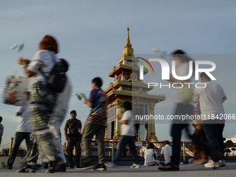 Buddhists and devotees pay homage to the Buddha's sacred tooth relics, which are temporarily enshrined in Thailand at the Sanam Luang ceremo...