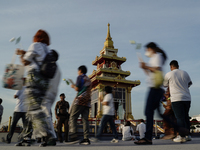 Buddhists and devotees pay homage to the Buddha's sacred tooth relics, which are temporarily enshrined in Thailand at the Sanam Luang ceremo...