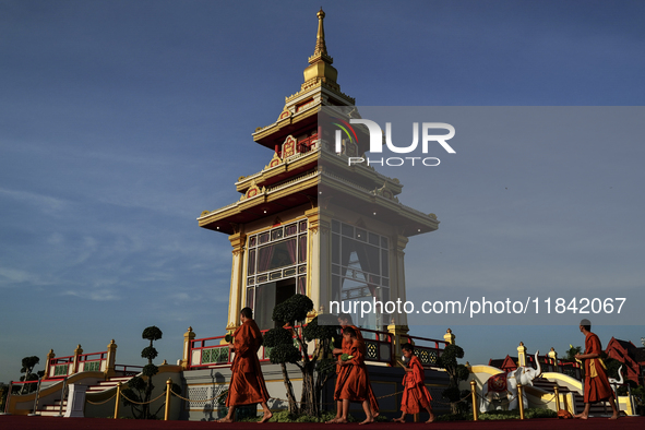 Buddhist monks chant and pay homage to the Buddha's sacred tooth relics, which are temporarily enshrined at the Sanam Luang ceremonial groun...