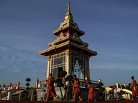 Buddhist monks chant and pay homage to the Buddha's sacred tooth relics, which are temporarily enshrined at the Sanam Luang ceremonial groun...