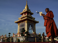 Buddhist monks chant and pay homage to the Buddha's sacred tooth relics, which are temporarily enshrined at the Sanam Luang ceremonial groun...