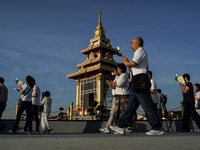 Buddhists and devotees pay homage to the Buddha's sacred tooth relics, which are temporarily enshrined in Thailand at the Sanam Luang ceremo...