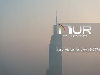 The Nanjing Zifeng Building looms under heavy fog in Nanjing, China, on December 7, 2024. (