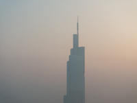 The Nanjing Zifeng Building looms under heavy fog in Nanjing, China, on December 7, 2024. (