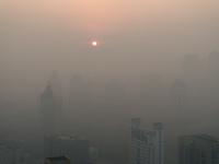 Buildings loom under heavy fog in Nanjing, China, on December 7, 2024. (