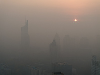 Buildings loom under heavy fog in Nanjing, China, on December 7, 2024. (