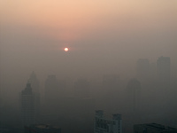 Buildings loom under heavy fog in Nanjing, China, on December 7, 2024. (