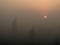 Buildings loom under heavy fog in Nanjing, China, on December 7, 2024. (