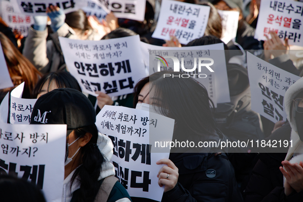 Hundreds of students from the National University Student Union gather in Yeouido, South Korea, on December 7, 2024, holding placards demand...