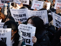 Hundreds of students from the National University Student Union gather in Yeouido, South Korea, on December 7, 2024, holding placards demand...