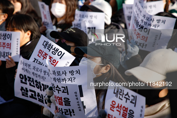 Hundreds of students from the National University Student Union gather in Yeouido, South Korea, on December 7, 2024, holding placards demand...