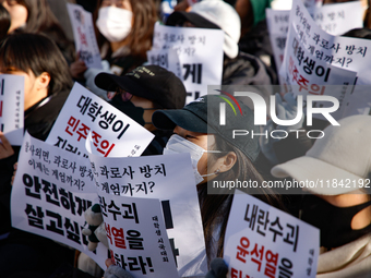 Hundreds of students from the National University Student Union gather in Yeouido, South Korea, on December 7, 2024, holding placards demand...