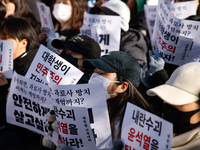 Hundreds of students from the National University Student Union gather in Yeouido, South Korea, on December 7, 2024, holding placards demand...