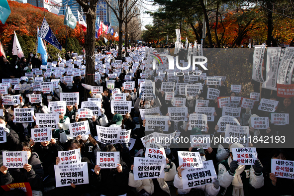 Hundreds of students from the National University Student Union gather in Yeouido, South Korea, on December 7, 2024, holding placards demand...