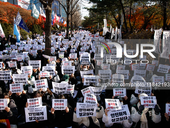 Hundreds of students from the National University Student Union gather in Yeouido, South Korea, on December 7, 2024, holding placards demand...