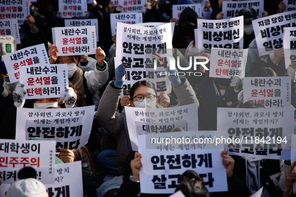 Hundreds of students from the National University Student Union gather in Yeouido, South Korea, on December 7, 2024, holding placards demand...