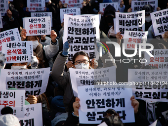 Hundreds of students from the National University Student Union gather in Yeouido, South Korea, on December 7, 2024, holding placards demand...