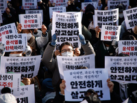 Hundreds of students from the National University Student Union gather in Yeouido, South Korea, on December 7, 2024, holding placards demand...